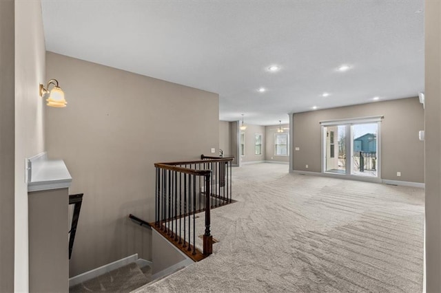 stairs with carpet flooring, recessed lighting, and baseboards