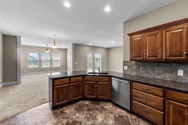 kitchen with a sink, stainless steel dishwasher, backsplash, a peninsula, and dark colored carpet