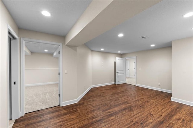 interior space featuring recessed lighting, baseboards, and wood finished floors