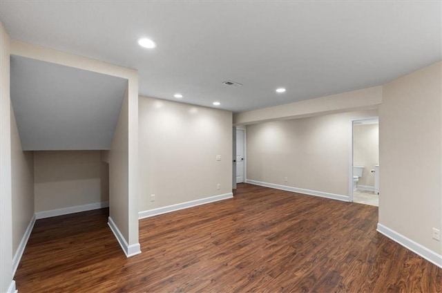 below grade area with recessed lighting, baseboards, and wood finished floors