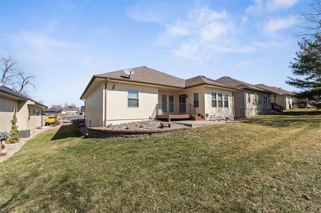 back of house with a yard, central AC, and a deck