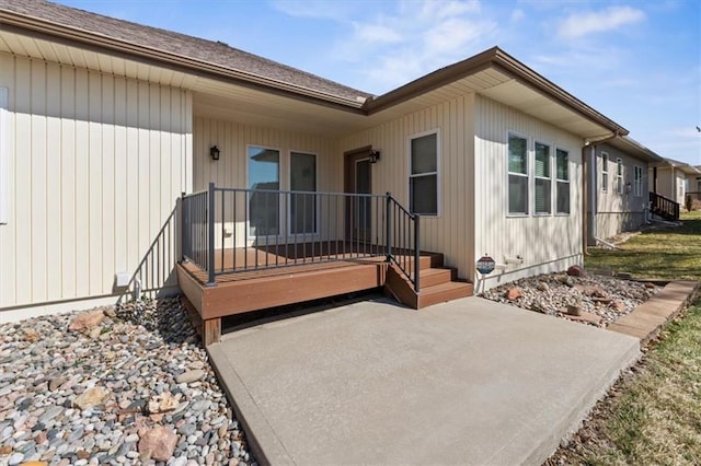 entrance to property featuring a patio