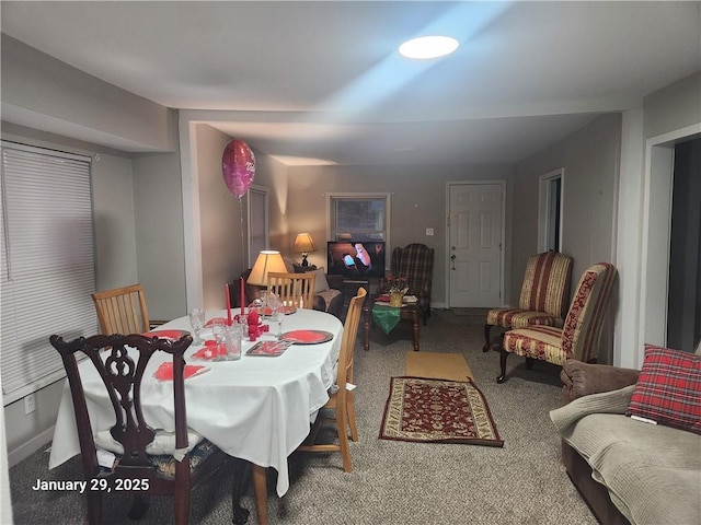 view of carpeted dining space