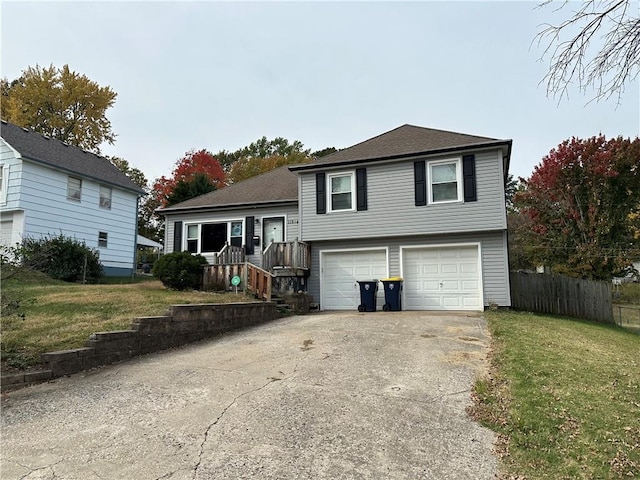 view of front of property with a garage and a front yard