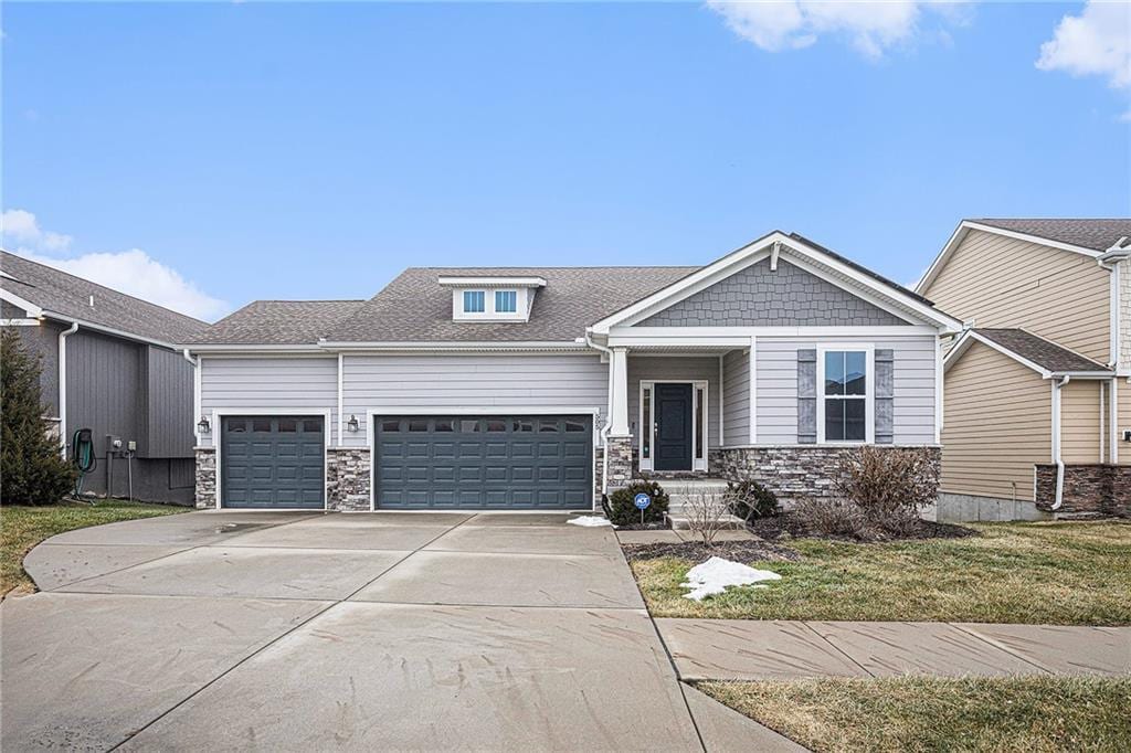 view of front of property with a garage and a front yard