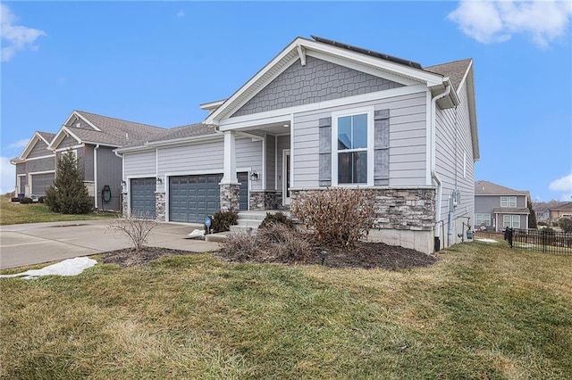 craftsman-style home with a garage and a front lawn