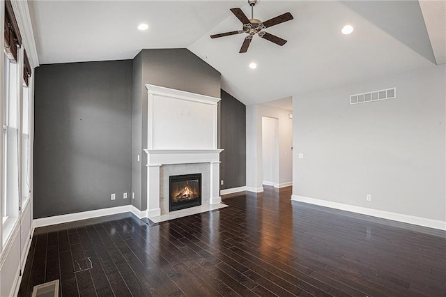 unfurnished living room with vaulted ceiling, dark wood-type flooring, and ceiling fan