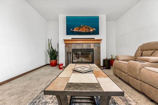 living area featuring carpet flooring, a fireplace, and baseboards