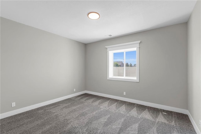 empty room with carpet flooring