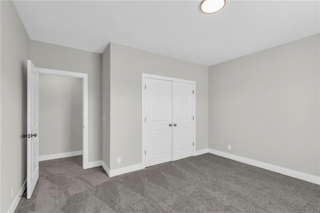 unfurnished bedroom with light carpet and a closet