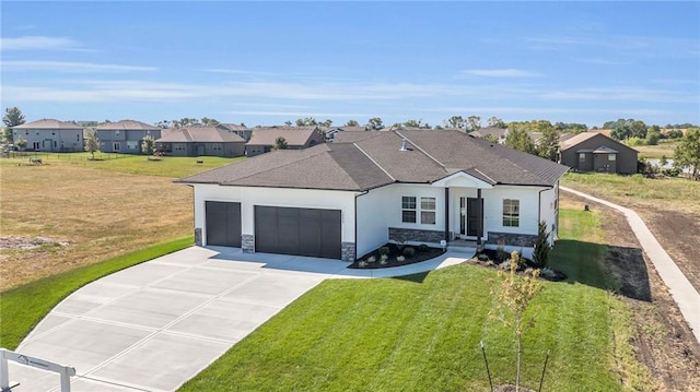 ranch-style home with a garage and a front lawn