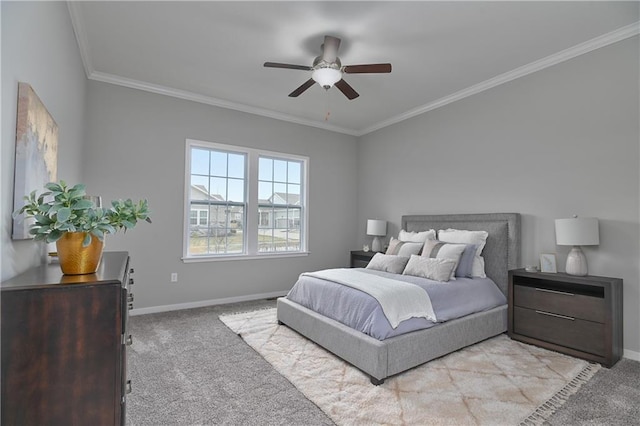 carpeted bedroom featuring crown molding and ceiling fan