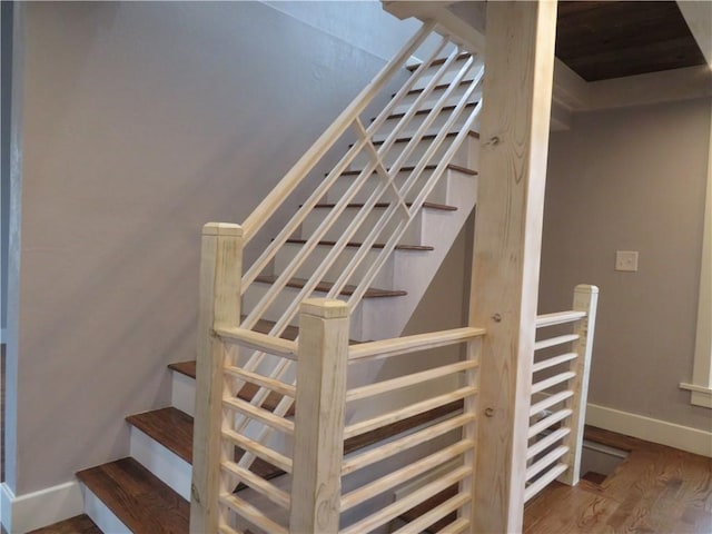 staircase featuring hardwood / wood-style flooring