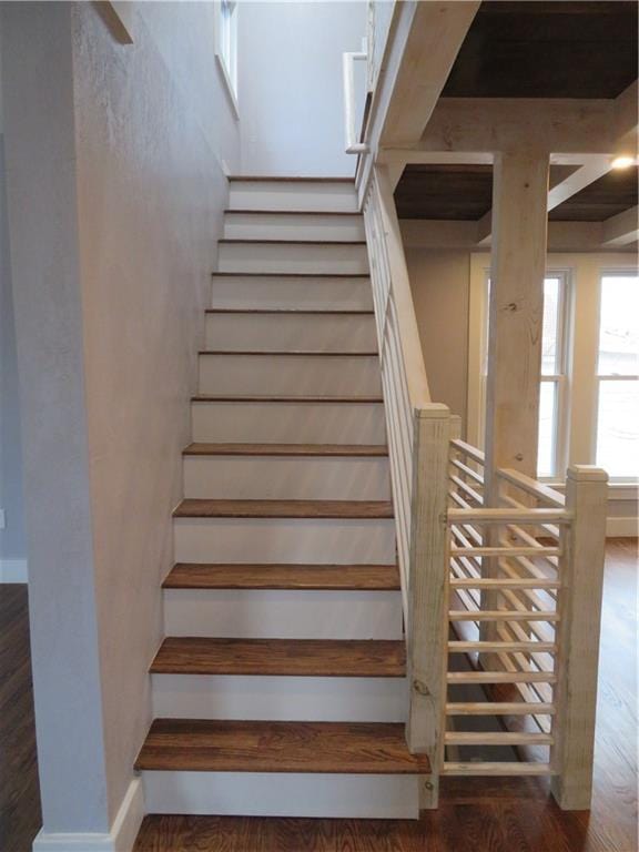 stairs featuring wood-type flooring