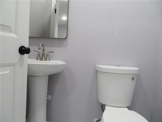 bathroom with sink and toilet