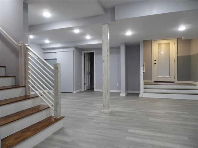 basement featuring light hardwood / wood-style flooring