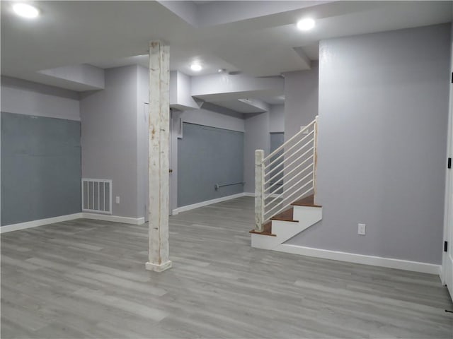 basement featuring light hardwood / wood-style floors