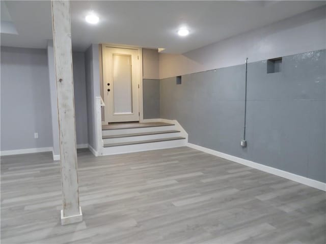 basement featuring light hardwood / wood-style flooring