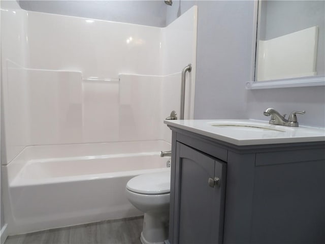 full bathroom with washtub / shower combination, vanity, and toilet