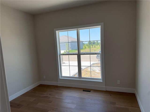 17351 S Kaw St, Olathe, KS 66062 - empty room featuring wood finished floors and baseboards
