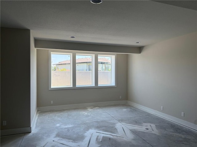 17351 S Kaw St, Olathe, KS 66062 - spare room featuring baseboards, concrete floors, and recessed lighting