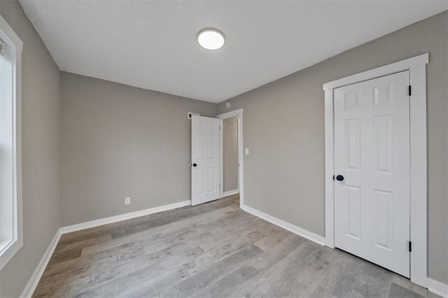 unfurnished bedroom with light hardwood / wood-style floors