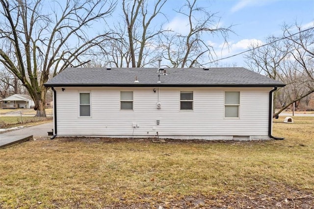 rear view of house with a lawn