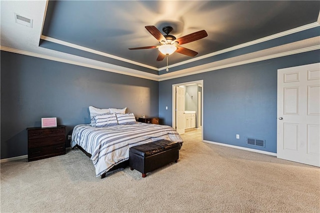 bedroom featuring light carpet, a tray ceiling, visible vents, and baseboards