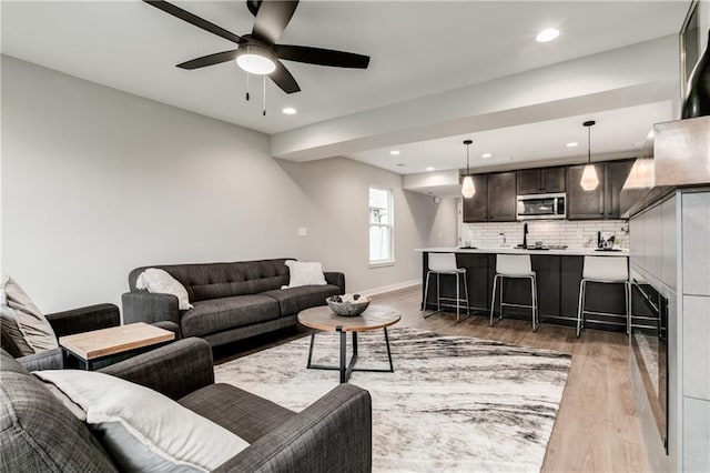 living room featuring dark hardwood / wood-style floors and ceiling fan