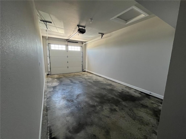 garage with baseboards and a garage door opener