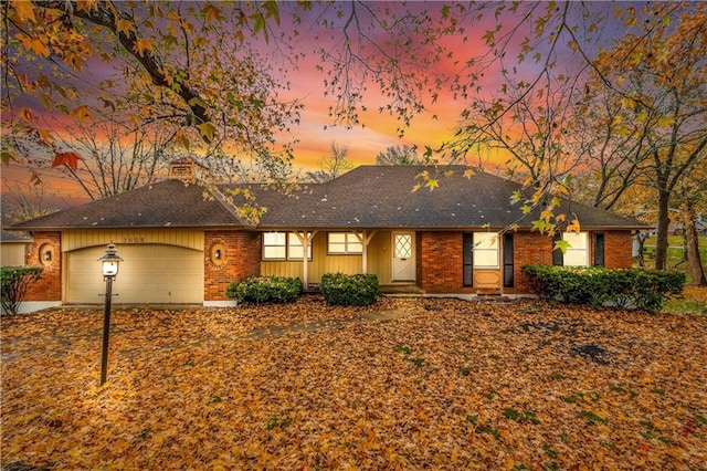 single story home with a garage