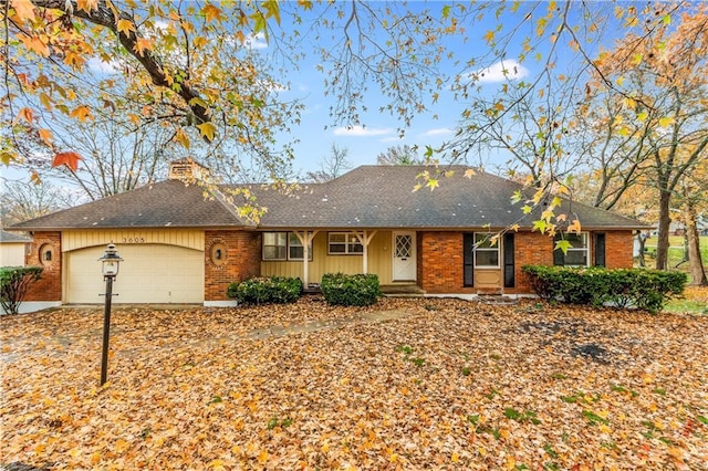 single story home featuring a garage