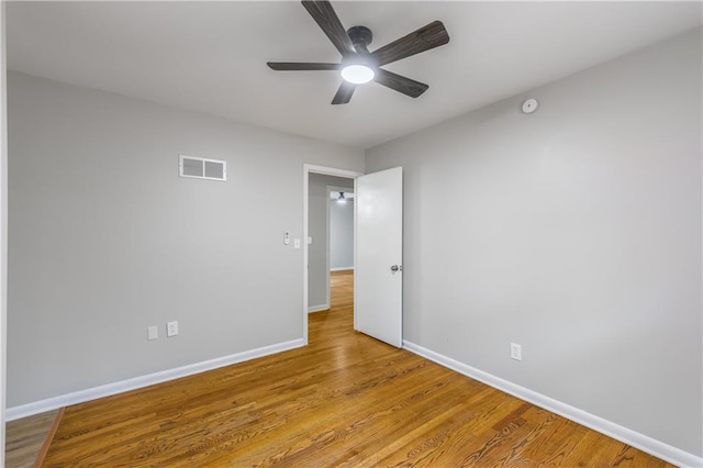 unfurnished bedroom with ceiling fan and light hardwood / wood-style flooring