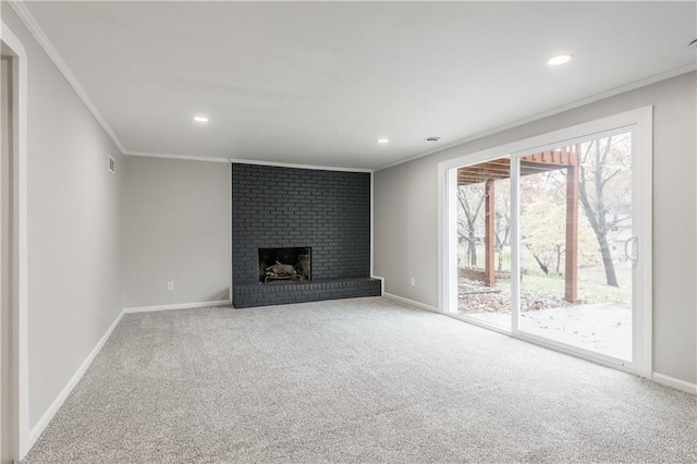 unfurnished living room with crown molding, a fireplace, and carpet floors