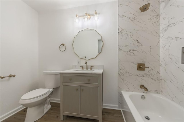 bathroom featuring shower / bathing tub combination, vanity, toilet, and wood finished floors