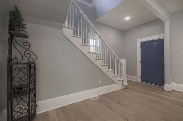 foyer entrance with light wood-type flooring