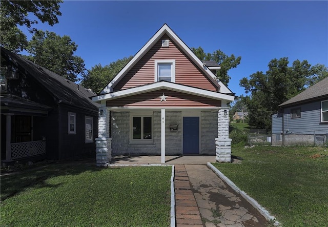 bungalow-style home featuring a patio and a front yard