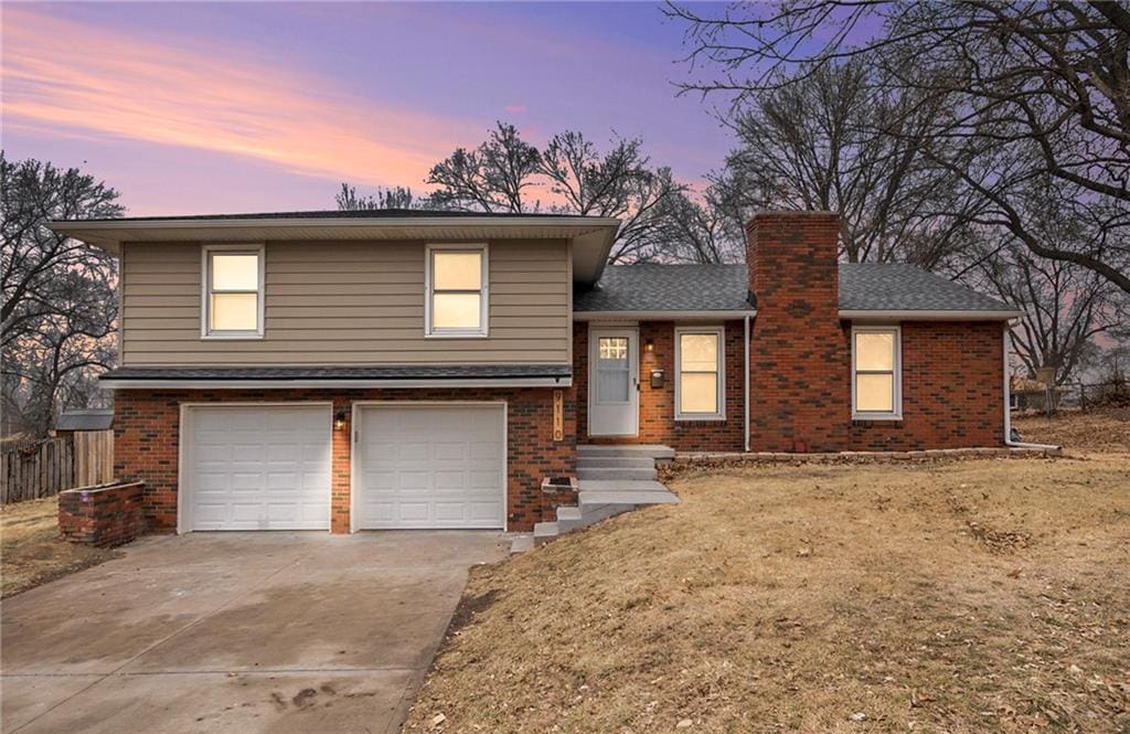 split level home featuring a garage