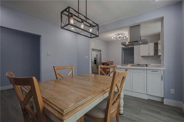 dining area with hardwood / wood-style flooring