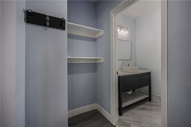 bathroom featuring vanity and hardwood / wood-style floors