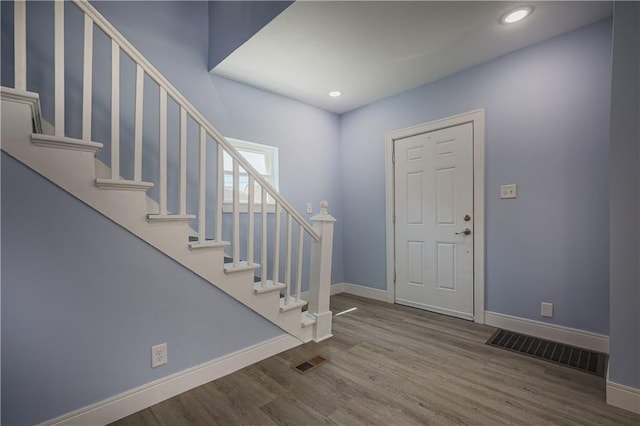 foyer entrance featuring hardwood / wood-style flooring