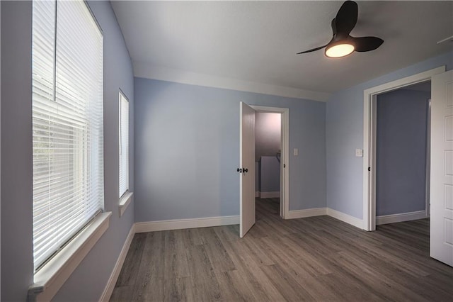 unfurnished bedroom featuring hardwood / wood-style floors and ceiling fan