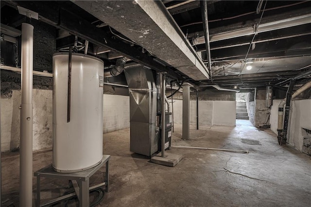 basement featuring heating unit and water heater