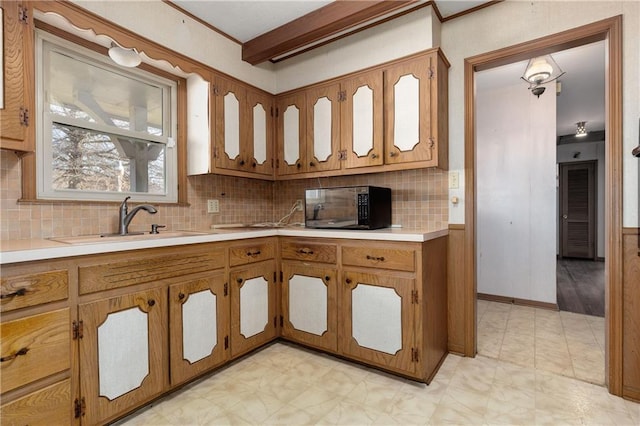 kitchen with sink and decorative backsplash