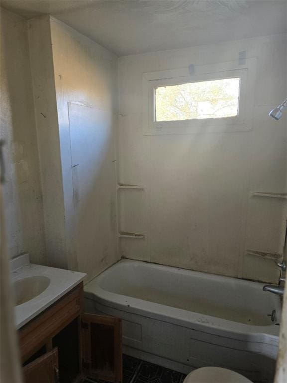 full bathroom featuring vanity, bathing tub / shower combination, and toilet