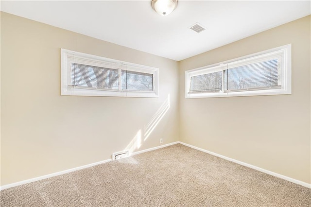 empty room with carpet flooring