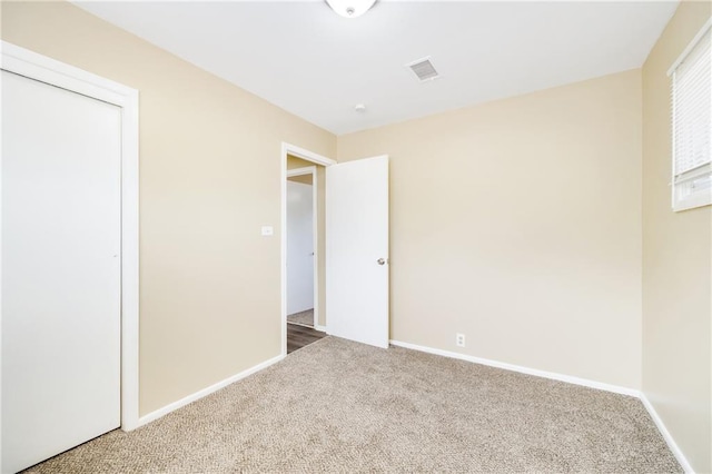 unfurnished bedroom with carpet flooring