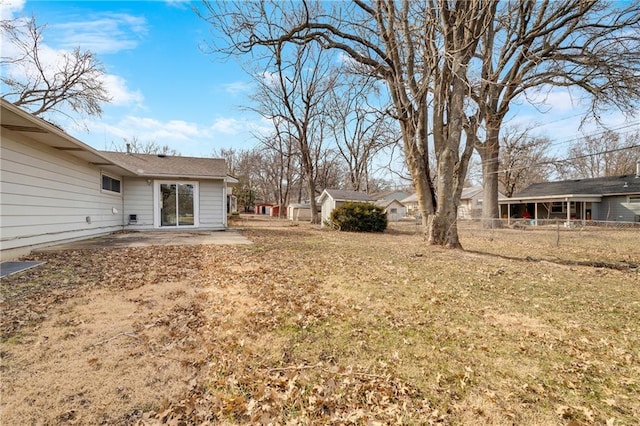 view of yard with a patio area and a storage unit