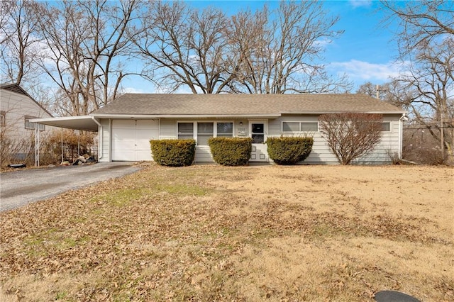 single story home featuring a garage and a carport