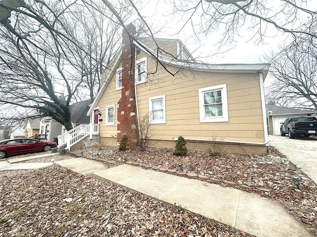 view of front of home with a chimney